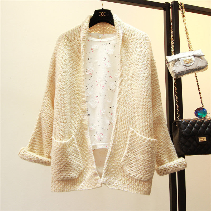 Ladies Large knitted cardigan with a relaxed fit and practical pockets Lune London