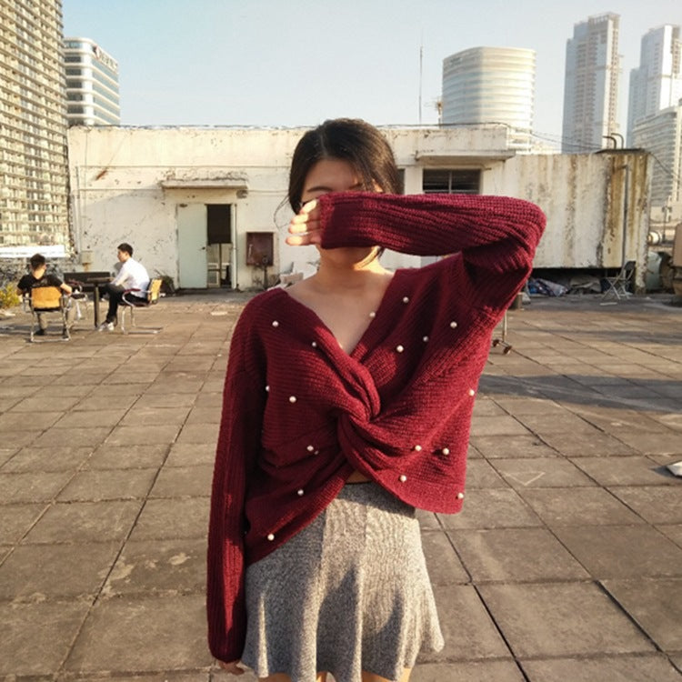 Knitted sweater for women with an asymmetrical design at the back and pearl embellished elements Lune London