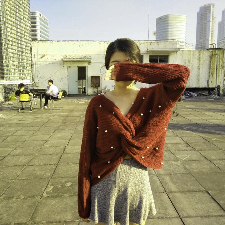 Knitted sweater for women with an asymmetrical design at the back and pearl embellished elements Lune London