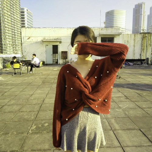 Knitted sweater for women with an asymmetrical design at the back and pearl embellished elements Lune London