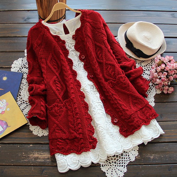 Women's knitted jacket with artistic cable details and romantic ruffle elements Lune London
