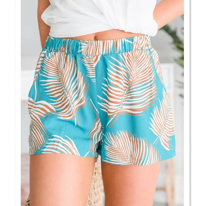 Women's breezy beach shorts with elastic waistband and tropical leaf design