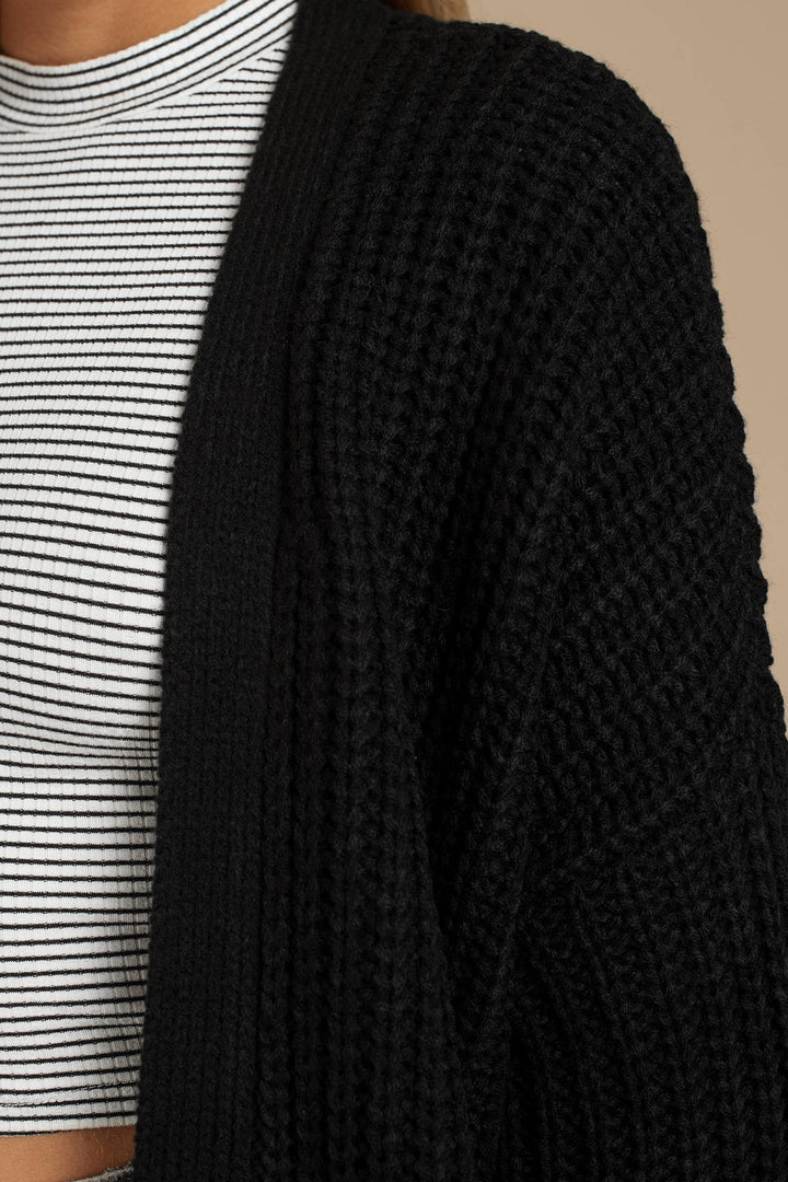 Womens chunky knit jacket with deep V-neck and relaxed fit Lune London