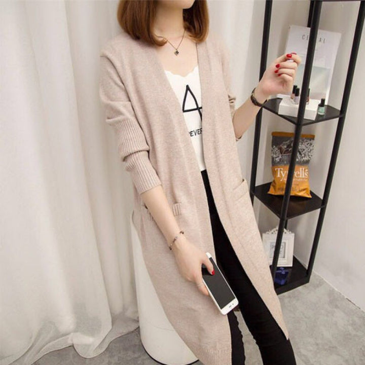 Ladies Long knitted cardigan with open front parts and deep pockets Lune London