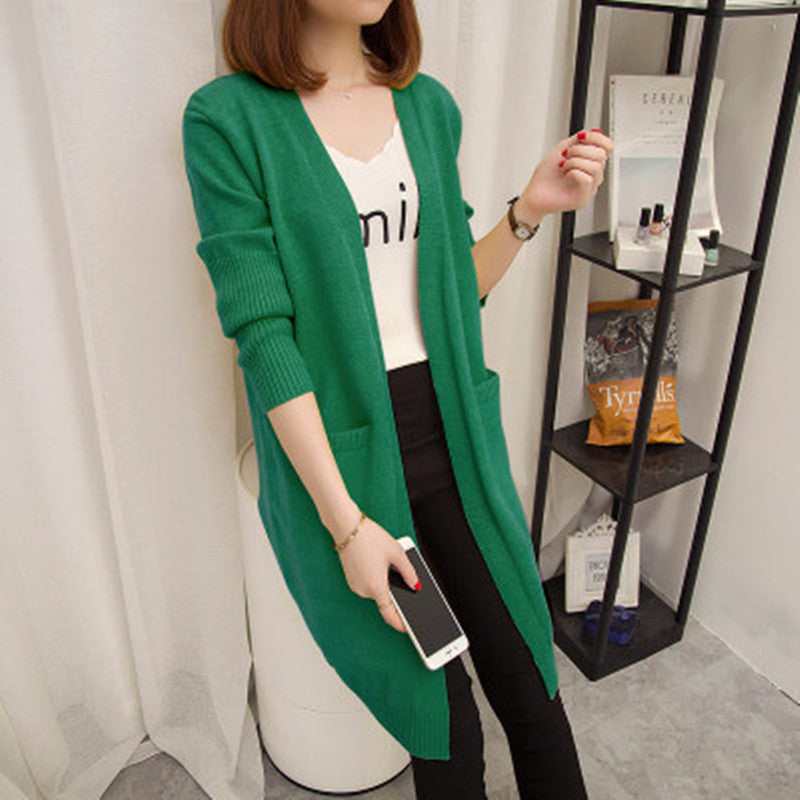 Ladies Long knitted cardigan with open front parts and deep pockets Lune London