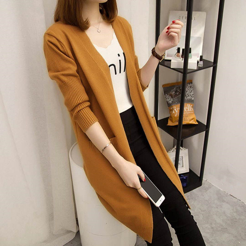 Ladies Long knitted cardigan with open front parts and deep pockets Lune London