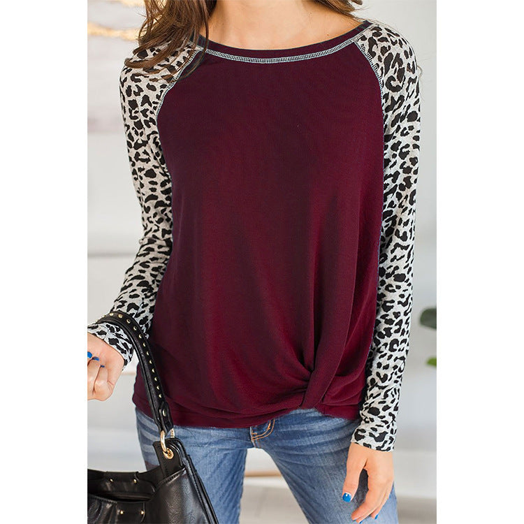 Top for women with an asymmetrical knot design and trendy animal print sleeves Lune London