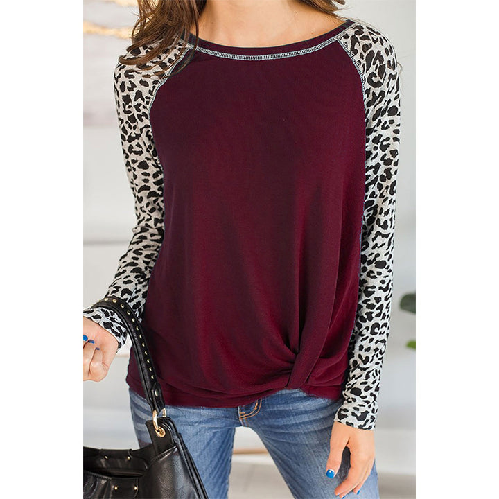 Top for women with an asymmetrical knot design and trendy animal print sleeves Lune London
