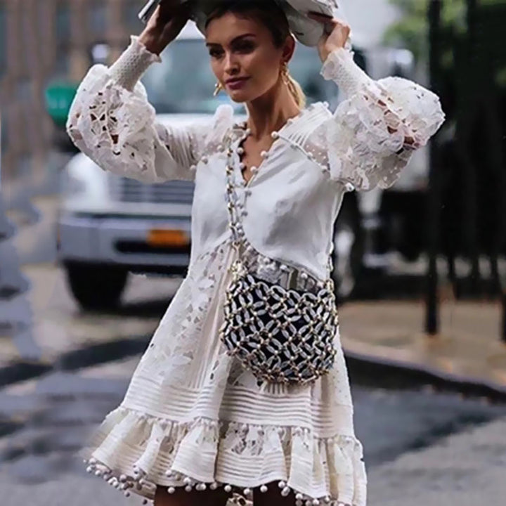 Women's playful floral dress with ruffle details and sheer puff sleeves Lune London
