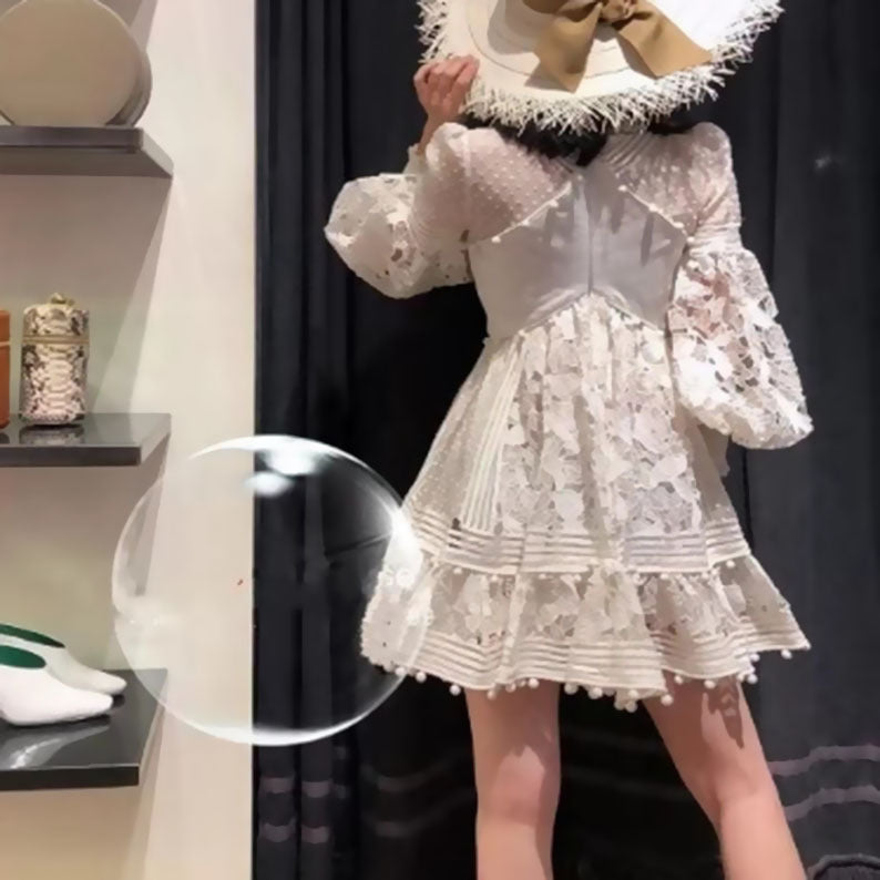 Women's playful floral dress with ruffle details and sheer puff sleeves Lune London