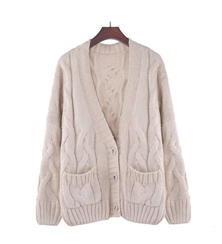 Thick knitted cardigan for women with classic braid pattern and practical pockets Lune London