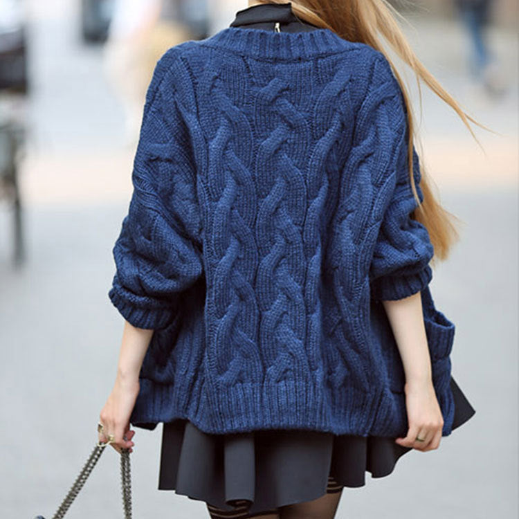 Thick knitted cardigan for women with classic braid pattern and practical pockets Lune London