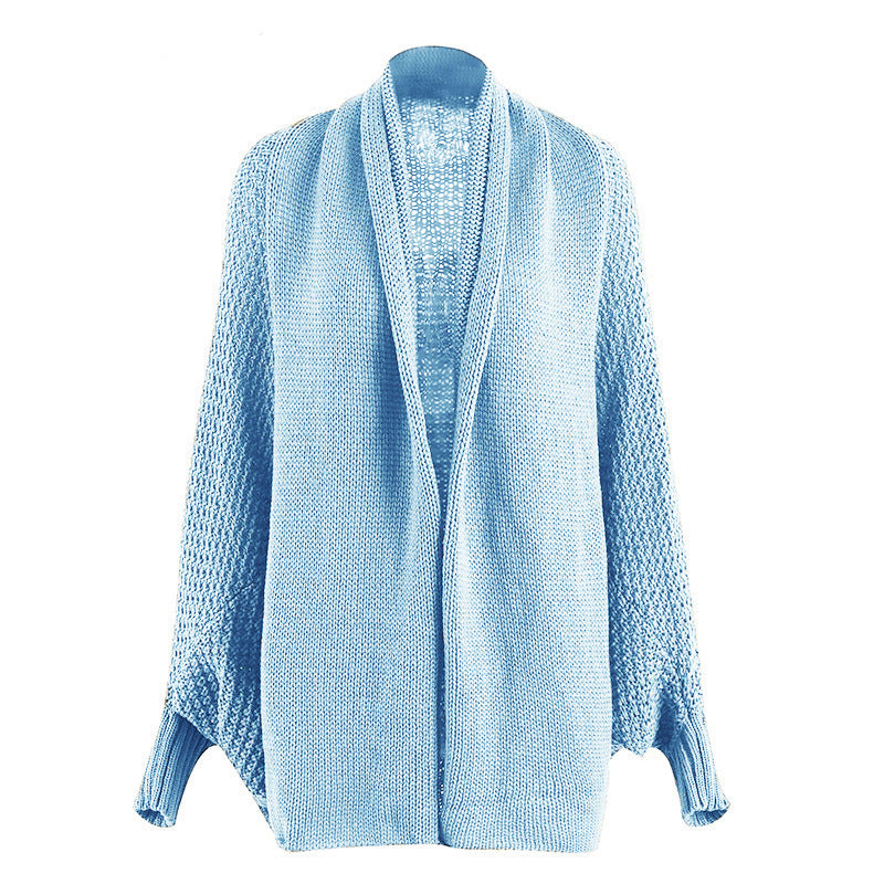 Women oversized knitted poncho with structured design and fringe details Lune London