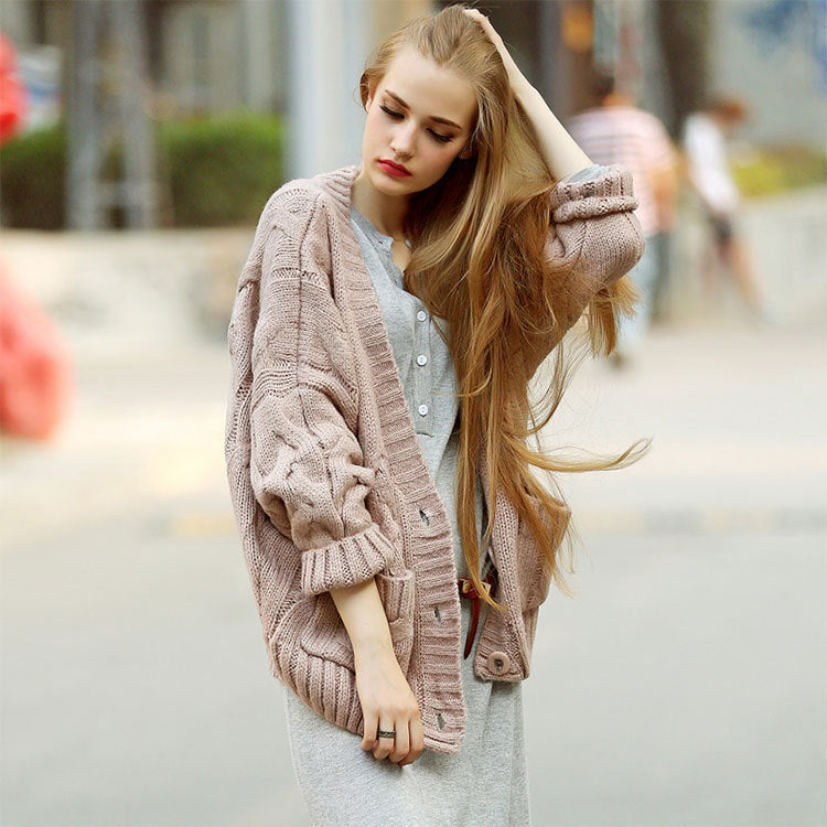 Thick knitted cardigan for women with classic braid pattern and practical pockets Lune London