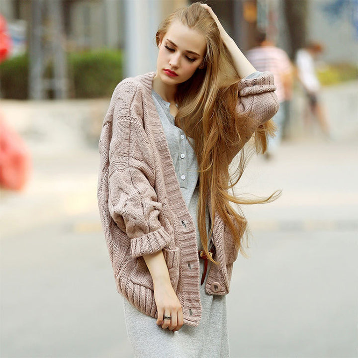 Thick knitted cardigan for women with classic braid pattern and practical pockets Lune London