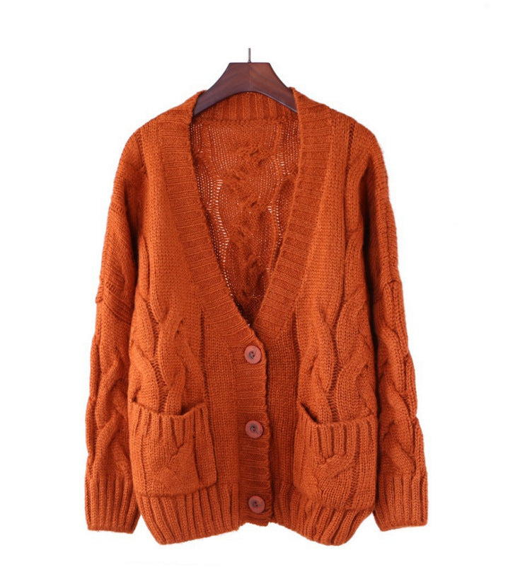 Thick knitted cardigan for women with classic braid pattern and practical pockets Lune London