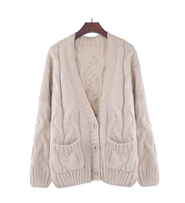 Thick knitted cardigan for women with classic braid pattern and practical pockets Lune London