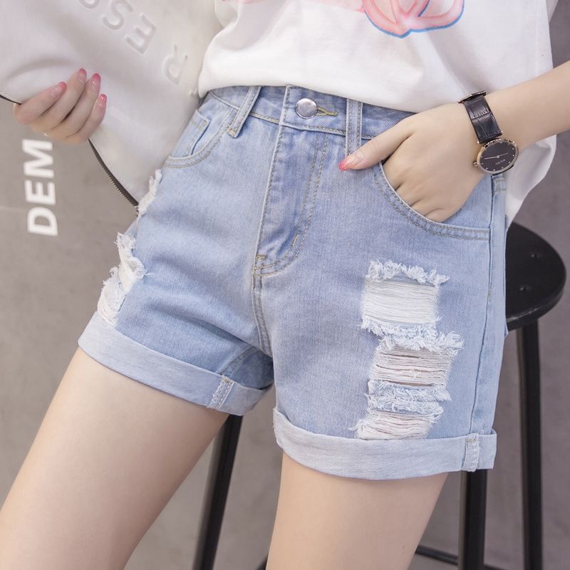 Women's denim shorts with trendy distressed design and casual cuff