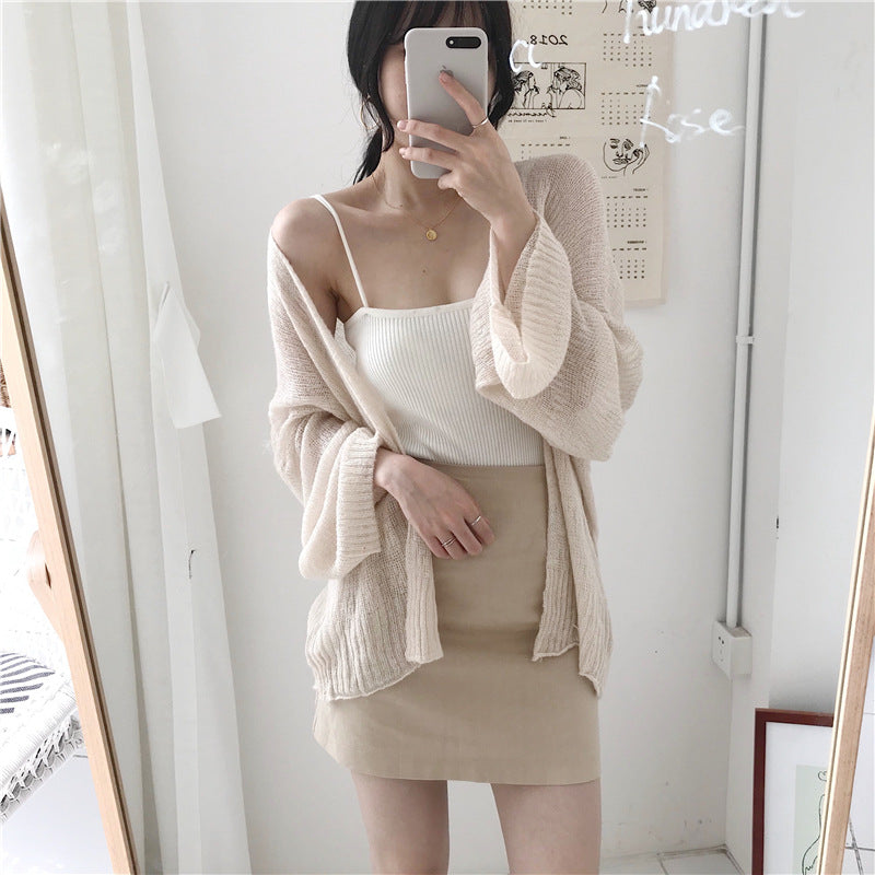 Casual knitted cardigan for women with a loose fit and open sleeves Lune Londonl