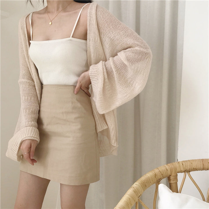 Casual knitted cardigan for women with a loose fit and open sleeves Lune Londonl