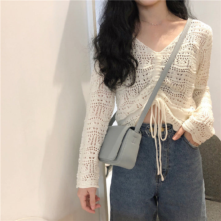 Knit sweater for women with a decorative hole pattern and an adjustable drawstring Lune London