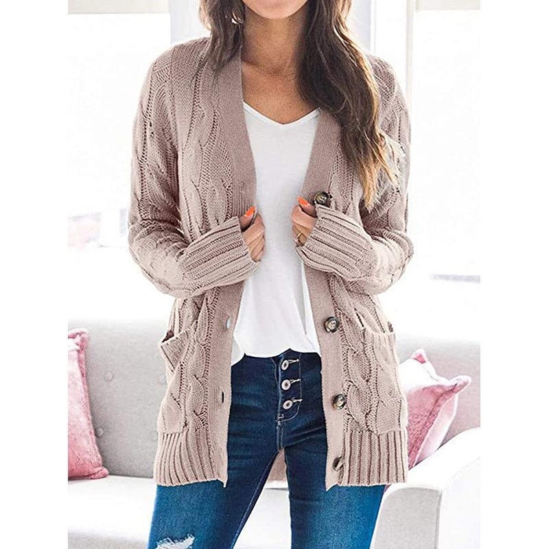 Chunky knit cardigan for women with an elaborate cable pattern and practical pockets Lune London