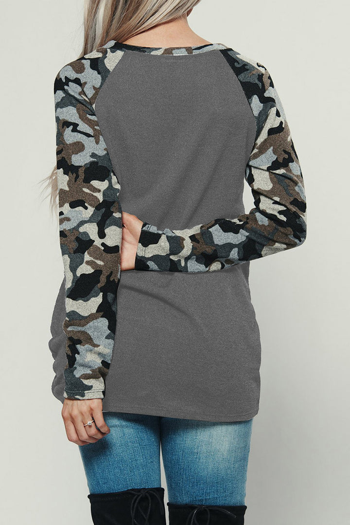 Casual long sleeve t-shirt for women with a unique camouflage design on the sleeves and a chic chest pocket style
