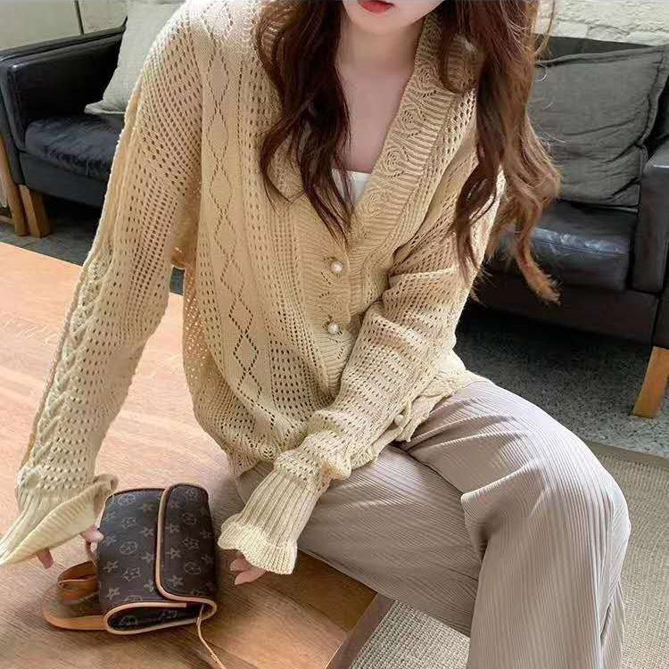 Casual knit jacket for women with an elegant cable pattern and large buttons Lune London