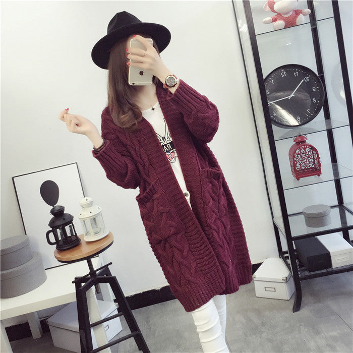 Chunky knit cardigan for women with elegant braided pattern and practical pockets Lune London