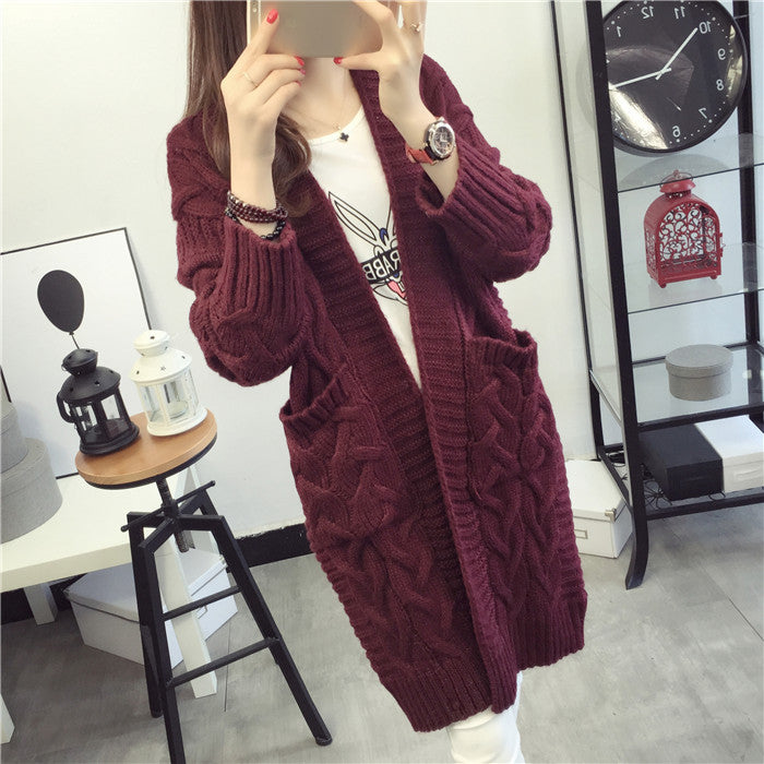 Chunky knit cardigan for women with elegant braided pattern and practical pockets Lune London