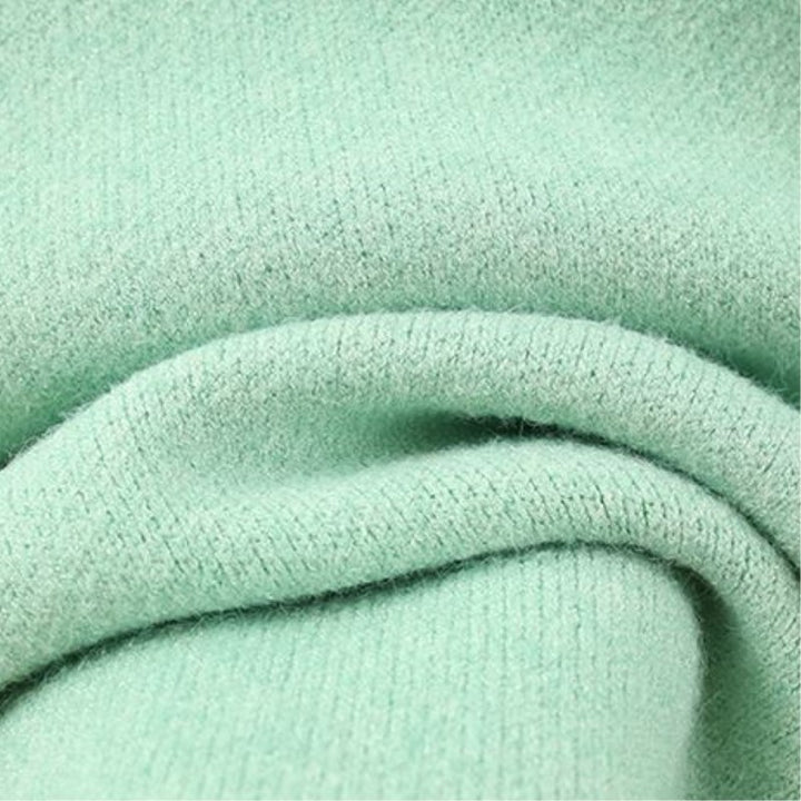 Women’s fashionable knitted set with a comfortable oversized sweater and a chic fitted dress.