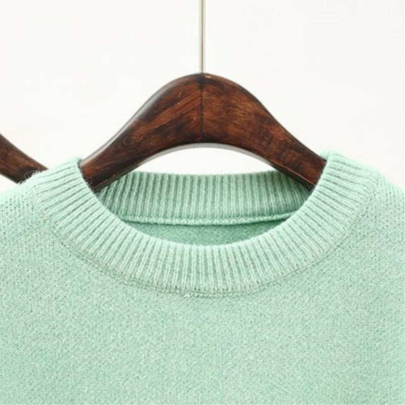 Women’s fashionable knitted set with a comfortable oversized sweater and a chic fitted dress.