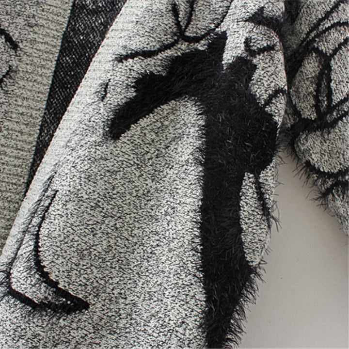 Women's knit dress with artistic graphic design and an elegant V-neck Chic and Style