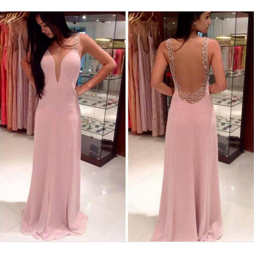 Ladies elegant evening dress with deep V-neck and shimmering details