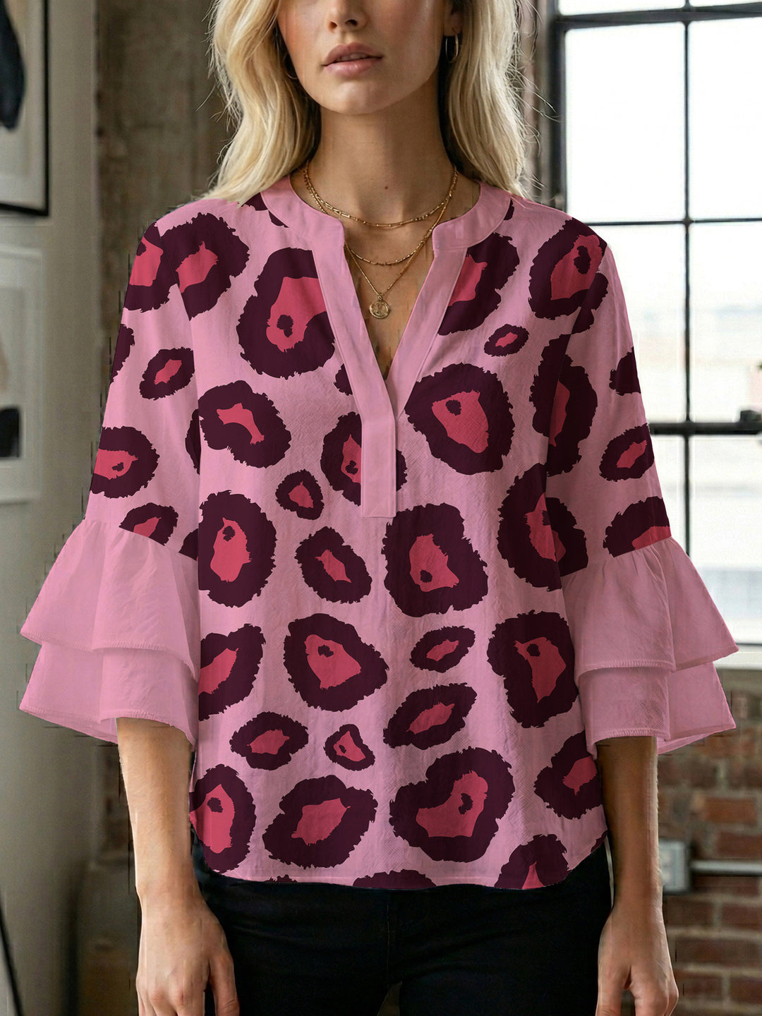 Women's blouse with ruffle details and eye-catching animal print Lune London