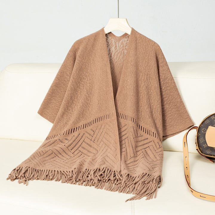 Elegant knitted poncho for women with fringe details and a distinctive pattern Lune London