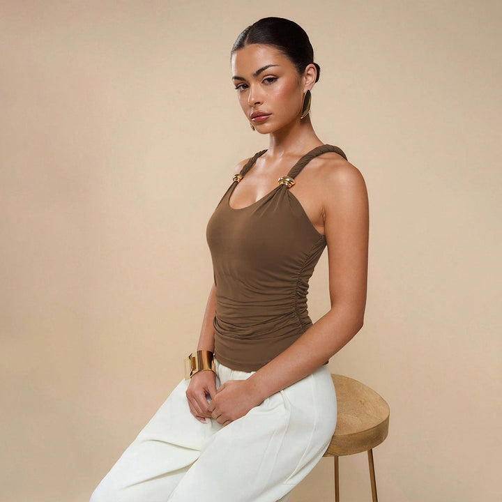 Elegant top for women with spaghetti straps featuring sophisticated bow details and a chic & stylish elastic waist.