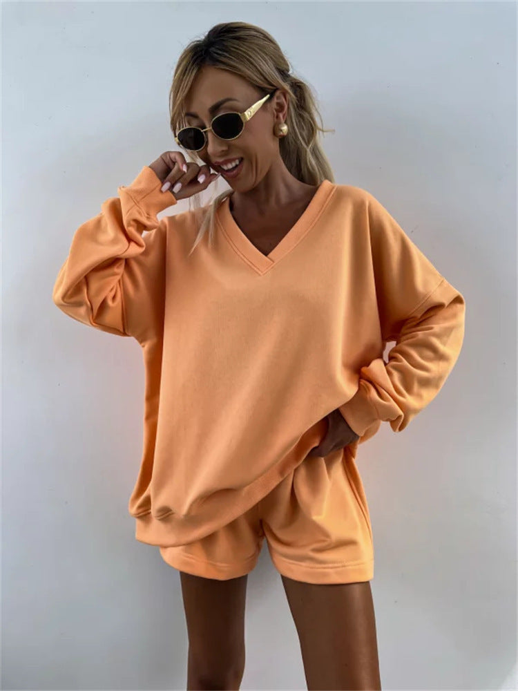 Casual outfit for women with oversized V-neck sweater and shorts Lune London