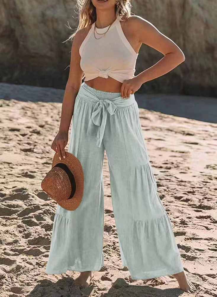 Airy palazzo pants for women with elastic waistband and practical tied belt Lune London