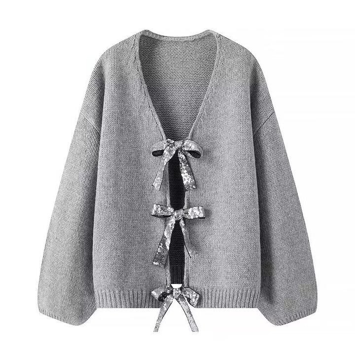 Cardigan en tricot stylé pour femme avec des nœuds glamours sur le bas