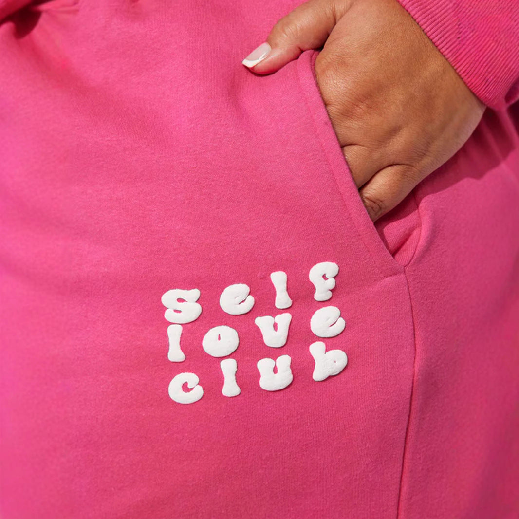 Women's wide jogging pants with elastic waistband and eye-catching lettering Chic & Stil