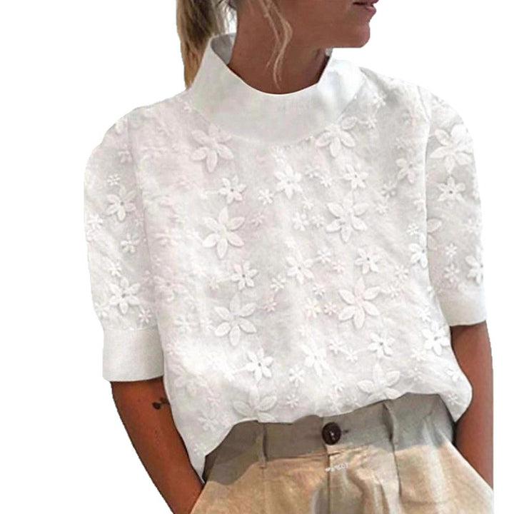 Blouse femme avec design de broderie florale et coupe courte Chic & Stil