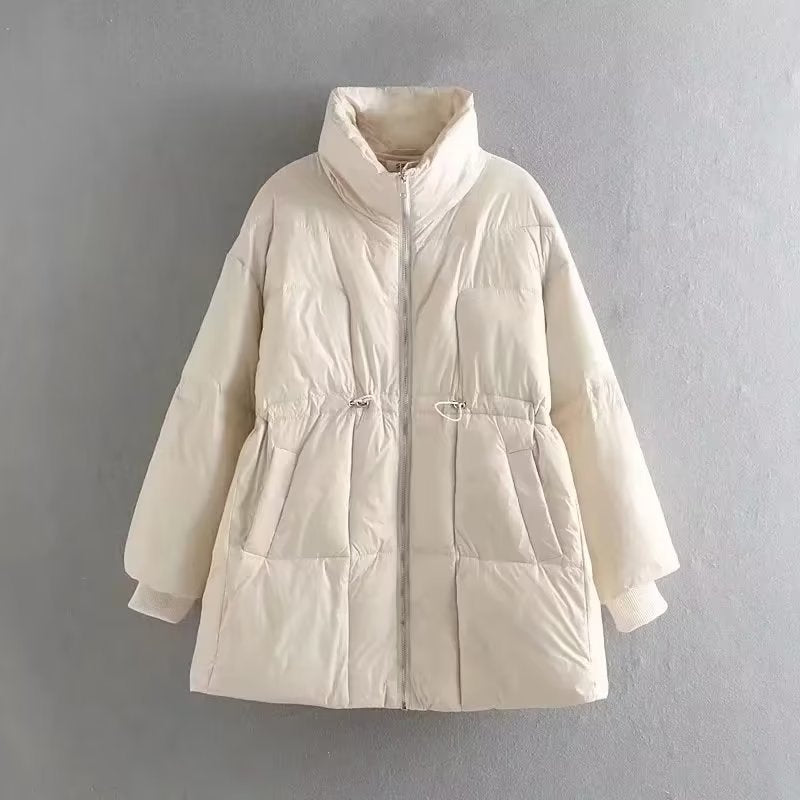 Quilted transition jacket for women with high collar and practical side pockets Lune London