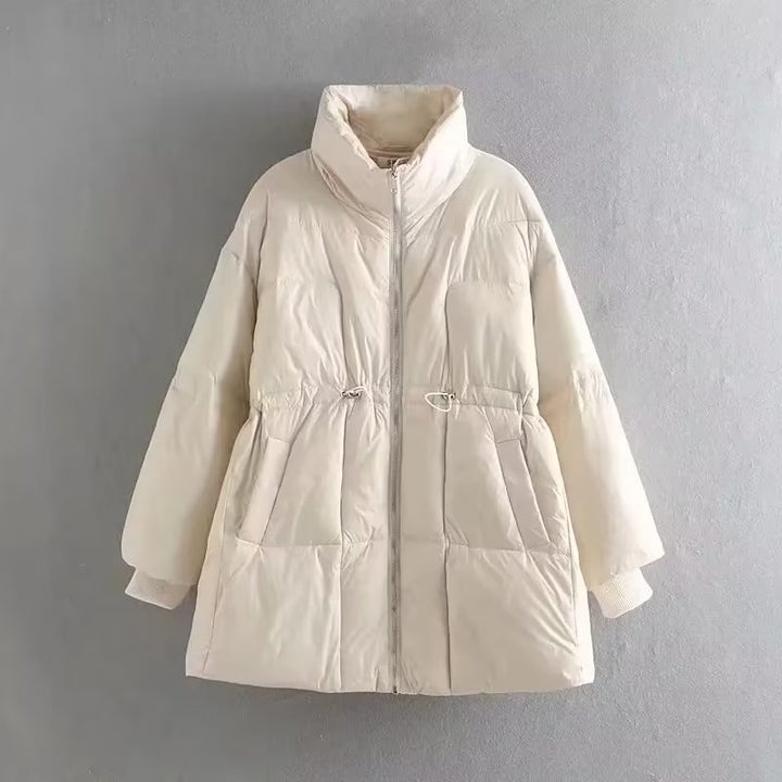 Quilted transition jacket for women with high collar and practical side pockets Lune London
