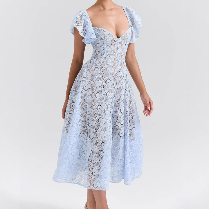 Maxi lace dress for women with voluminous ruffles and a subtle heart-shaped neckline Chic & Stil