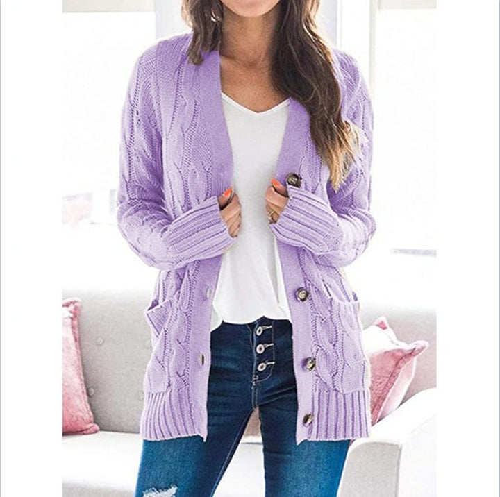 Chunky knit cardigan for women with an elaborate cable pattern and practical pockets Lune London