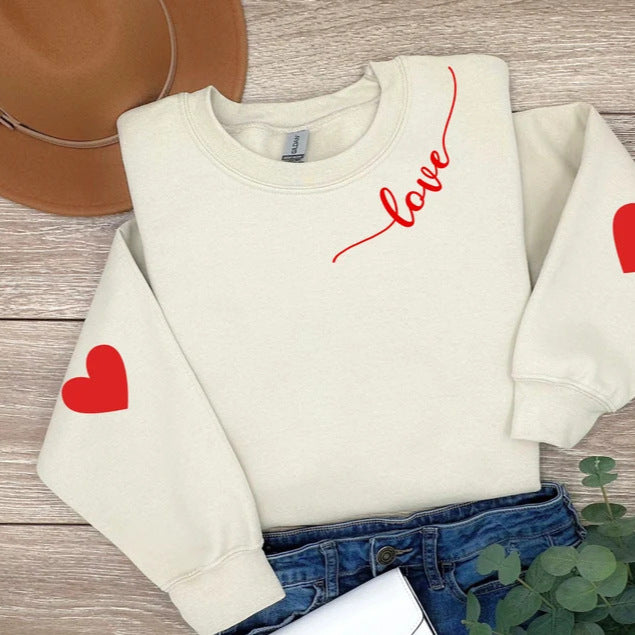 Sweatshirt femme avec design cœur et coupe décontractée Chic & Stil