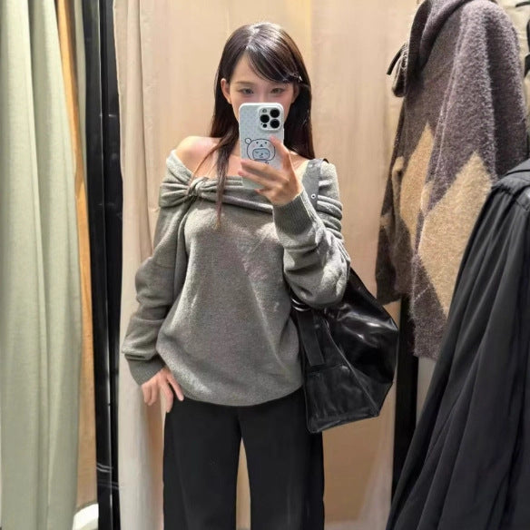 Pull élégant pour femmes avec col châle asymétrique et fermeture décorative Chic & Stil