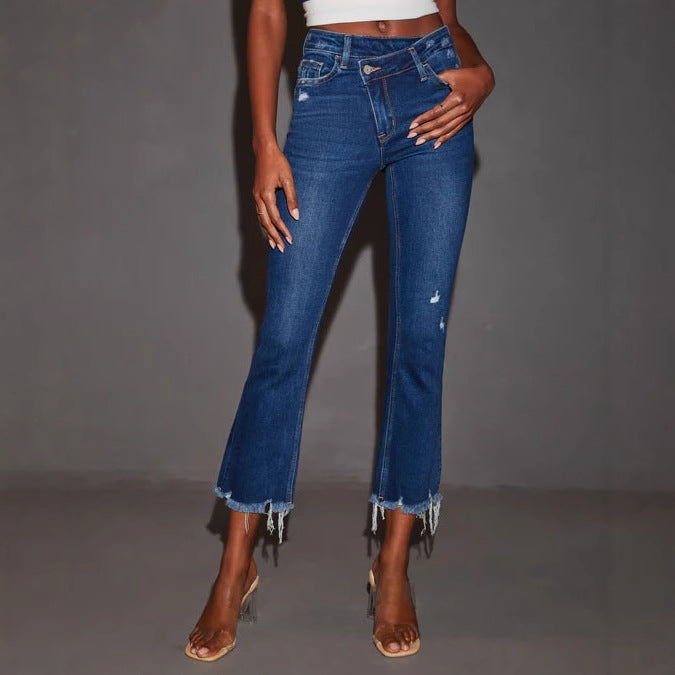 Women's flared jeans with trendy destroyed details and frayed hems