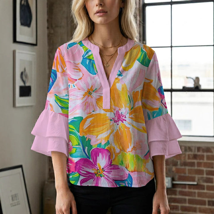 Women’s blouse with voluminous ruffled sleeves and floral pattern Lune London